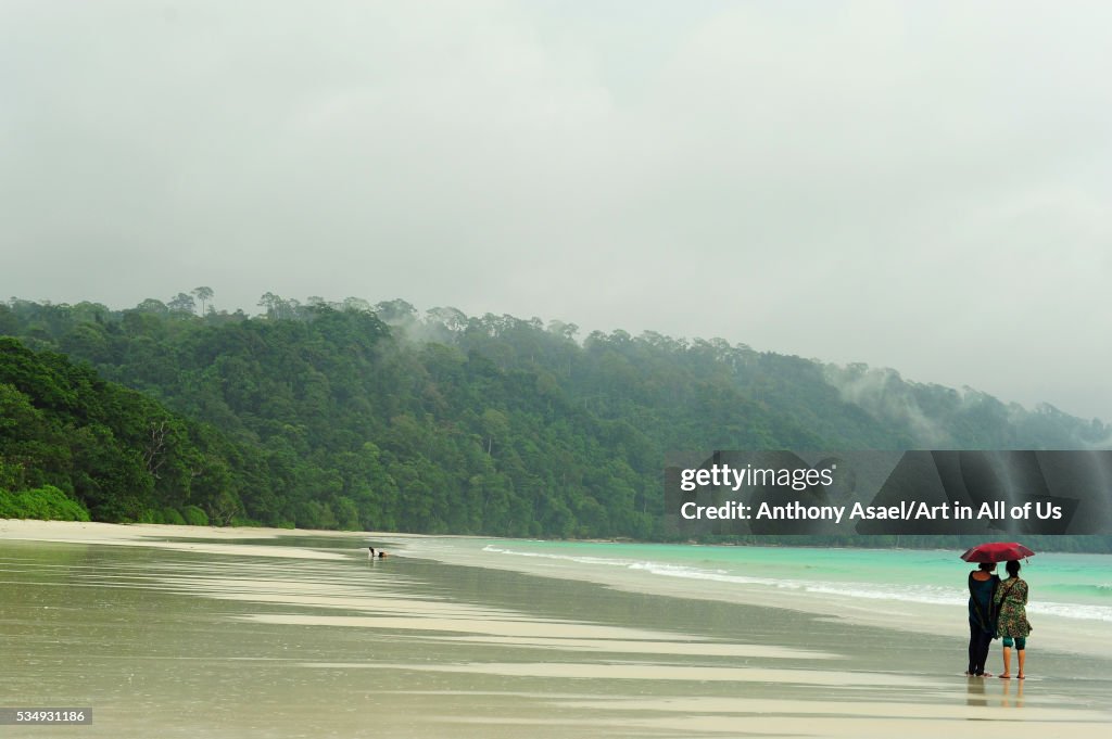 India, Andaman Islands, Havelock, Indian tourist below umbrella on beach number 7