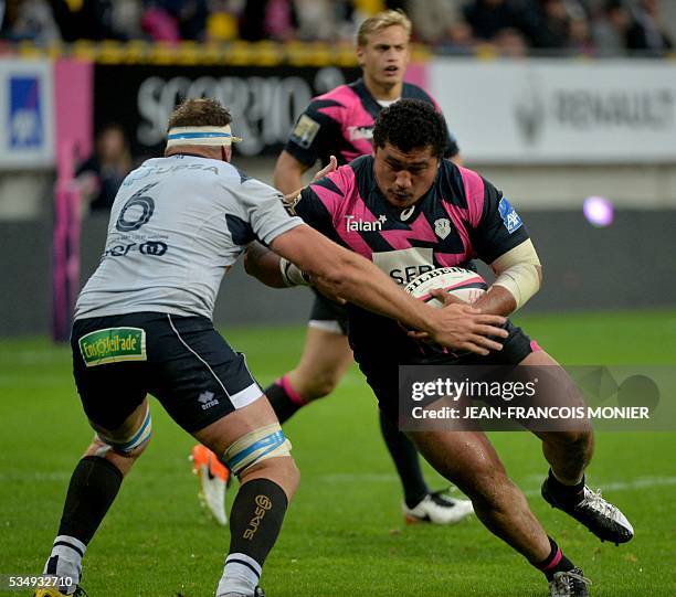 Stade Francais Paris' Samoan prop Sakaria Taufalo is tackled by Agen's South African hooker Marco Kotze during the French Top 14 rugby union match...