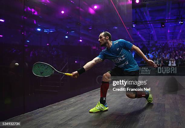 Gregory Gaultier of France competes against Cameron Pilley of Australia during the men's final match of the PSA Dubai World Series Finals 2016 at...