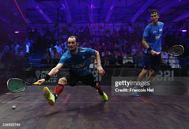 Gregory Gaultier of France competes against Cameron Pilley of Australia during the men's final match of the PSA Dubai World Series Finals 2016 at...