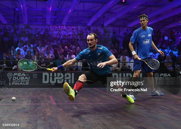 Gregory Gaultier of France competes against Cameron Pilley of Australia during the men's final match of the PSA Dubai World Series Finals 2016 at...