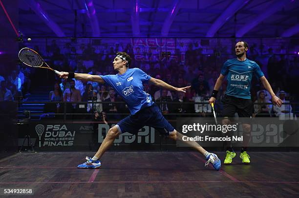 Cameron Pilley of Australia competes against Gregory Gaultier of France during the men's final match of the PSA Dubai World Series Finals 2016 at...