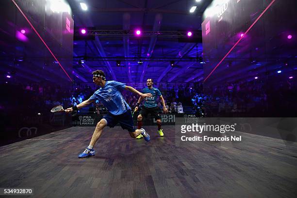 Cameron Pilley of Australia competes against Gregory Gaultier of France during the men's final match of the PSA Dubai World Series Finals 2016 at...