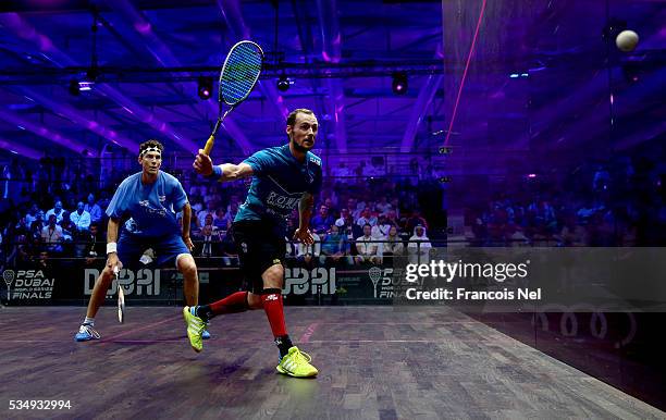 Gregory Gaultier of France competes against Cameron Pilley of Australia during the men's final match of the PSA Dubai World Series Finals 2016 at...