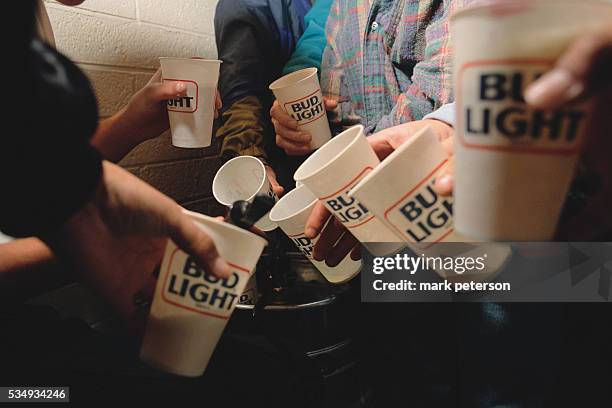 Arizona State University students fill up keg cups at a party at the Sun Devil Ski Club.