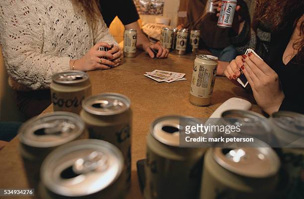 Arizona State University students play cards and drink beer at the Manzanita Residence Hall Dormitory.