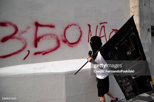 sprayed graffiti - public transport protest in sao paulo stock pictures, royalty-free photos & images