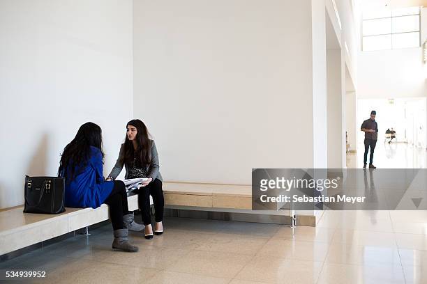 Two students study together in the halls of the American University of Iraq, Sulaimani .