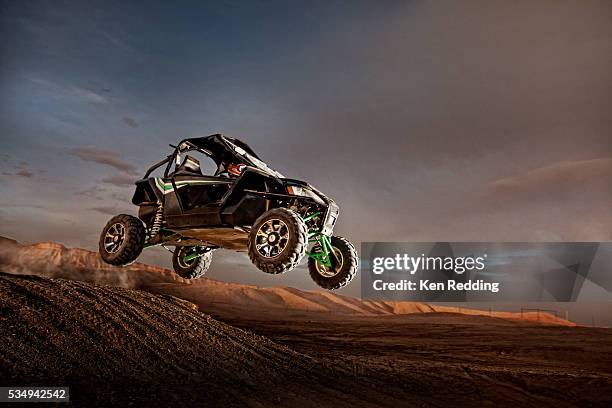 all terrain vehicle in mid-air - vintage racing driver stock pictures, royalty-free photos & images