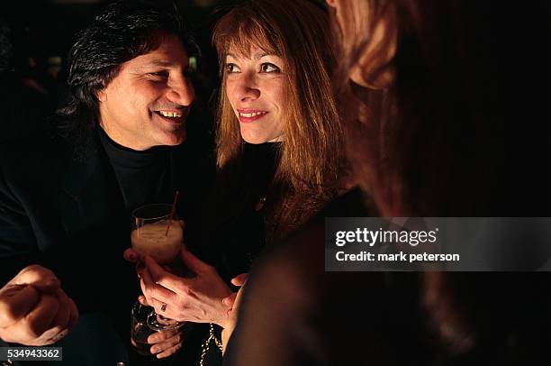 Couple shares drinks and conversation at Decade, a nightclub in Manhattan.