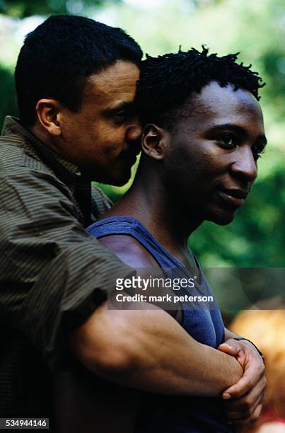 Gay African American Couple Embracing at Wigstock