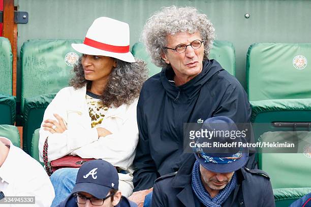 Elie Chouraqui and guest attend the Jo Wilfied Tsonga match during the French Tennis Open at Roland Garros on May 28, 2016 in Paris, France.