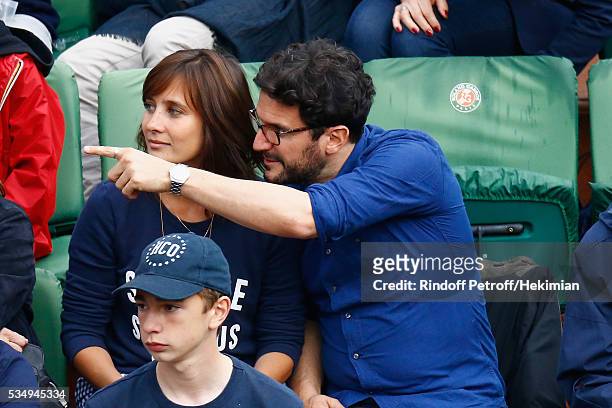 Julie de Bona and her boyfriend attend the Jo Wilfied Tsonga match during the French Tennis Open at Roland Garros on May 28, 2016 in Paris, France.