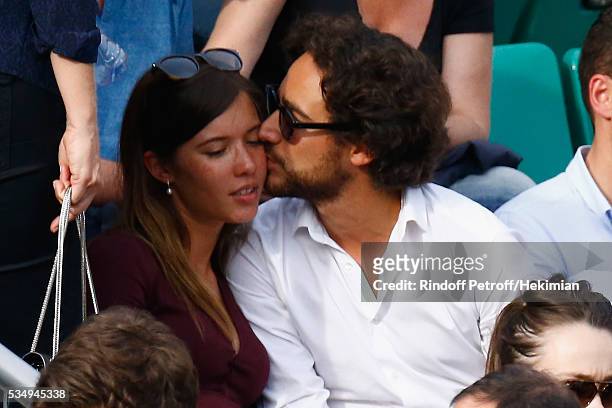 Thomas Hollande and his girlfriend attend the Jo Wilfied Tsonga match during the French Tennis Open at Roland Garros on May 28, 2016 in Paris, France.