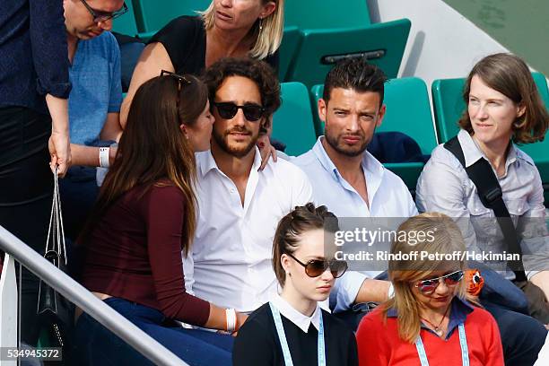 Thomas Hollande and his girlfriend attend the Jo Wilfied Tsonga match during the French Tennis Open at Roland Garros on May 28, 2016 in Paris, France.