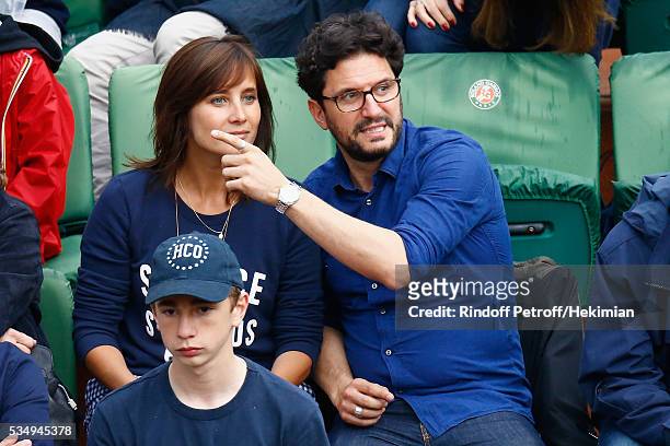Julie de Bona and her boyfriend attend the Jo Wilfied Tsonga match during the French Tennis Open at Roland Garros on May 28, 2016 in Paris, France.