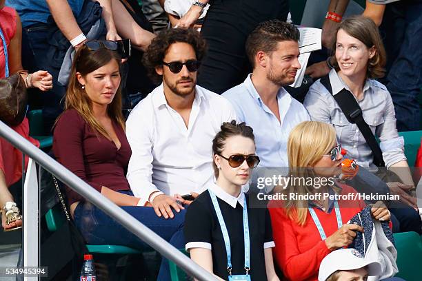 Thomas Hollande and his girlfriend attend the Jo Wilfied Tsonga match during the French Tennis Open at Roland Garros on May 28, 2016 in Paris, France.