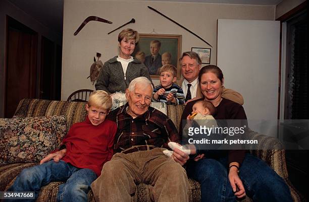 Ray Crist, 100-year-old chemist, poses with his wife Donna, his son Henry, his granddaughter, and his great-grandchildren in Carlisle, Pennsylvania....