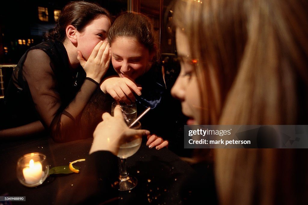 Girl Telling a Secret to a Friend