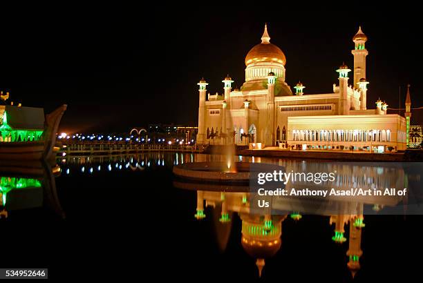 Brunei Darussalam, Bandar Seri Begawan, nightview of reflection of illuminated mosque in lake at night