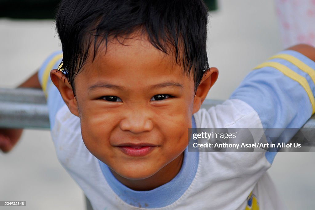 Brunei Darussalam, Kampong Ayer, portrait of a boy playing