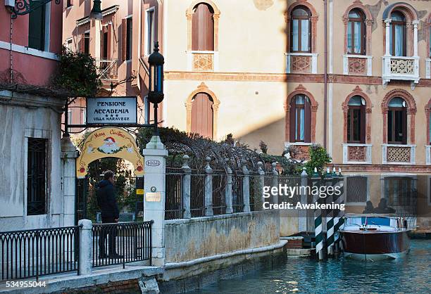 Italy's outgoing Prime Minister Mario Monti on a private visit with his family to Venice and Saint Mark's Square. In the photograph the 3 stars hotel...