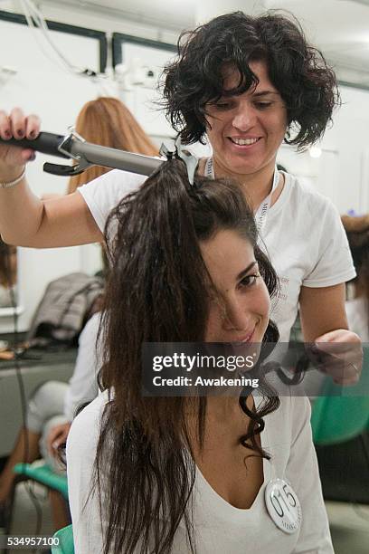 Model is prepared backstage at the Miss Italia show during Miss Italia on October 26; 2013 in Jesolo; Italy.