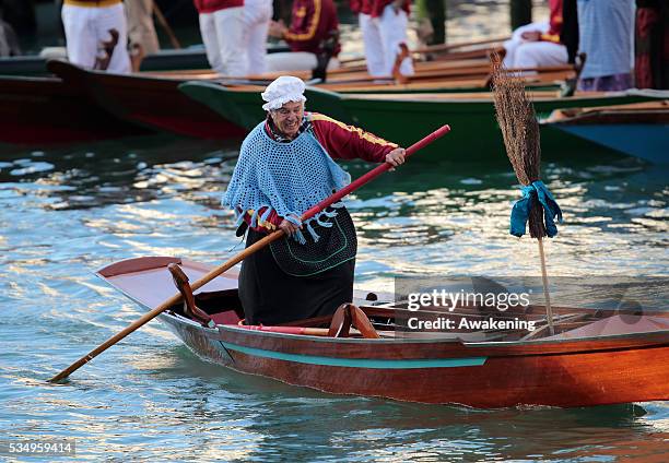 One of the costumed participants races along the Grand Canal for the 'Befana' Regatta on January 6, 2014 in Venice, Italy. In Italian folklore,...