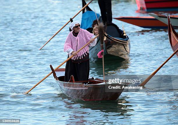 One of the costumed participants races along the Grand Canal for the 'Befana' Regatta on January 6, 2014 in Venice, Italy. In Italian folklore,...