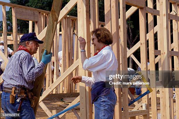 Jimmy Carter and wife Rosalynn Carter help build a house for Habitat for Humanity. The Carters lead the Jimmy Carter Work Project for Habitat for...