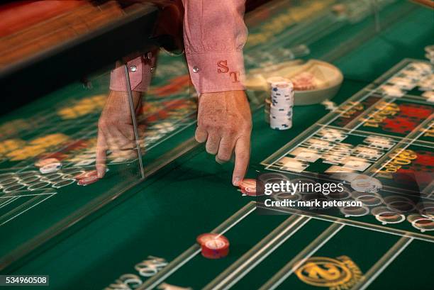 Gambler places chips on a craps table at Sam's Town Casino a day before it's grand opening.