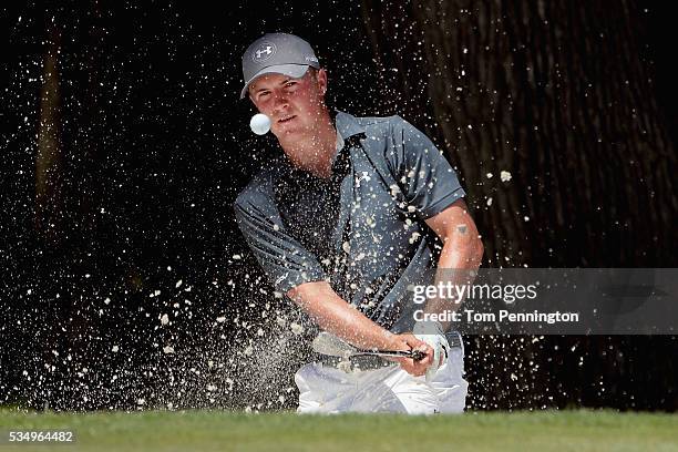 Jordan Spieth hits a shot out of the bunker on the eighth hole during the Third Round of the DEAN & DELUCA Invitational at Colonial Country Club on...
