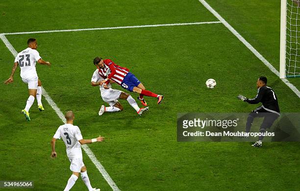 Yannick Carrasco of Atletico Madrid beats Lucas Vazquez of Real Madrid to the ball to score the equalising goal during the UEFA Champions League...