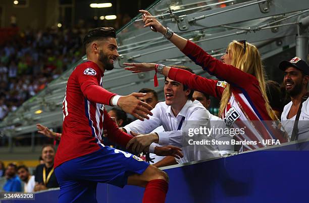 Yannick Carrasco of Atletico Madrid celebrates with his girlfriend in the crowd during the UEFA Champions League Final between Real Madrid and Club...