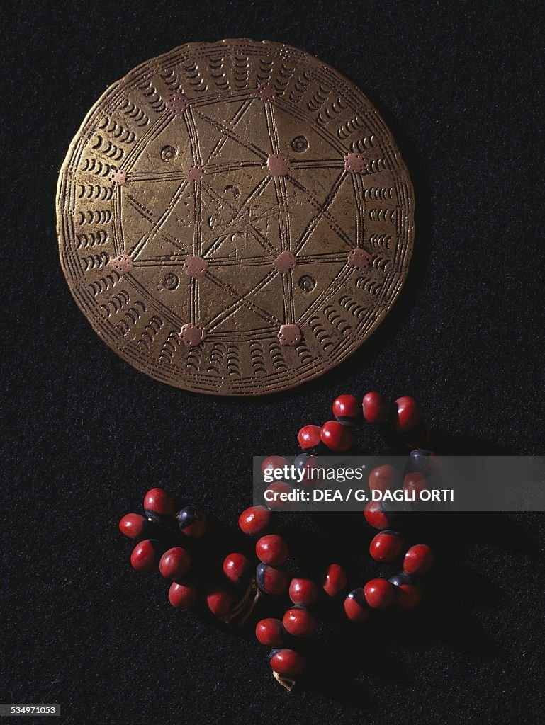 Memory disc and Rosary pea seeds...