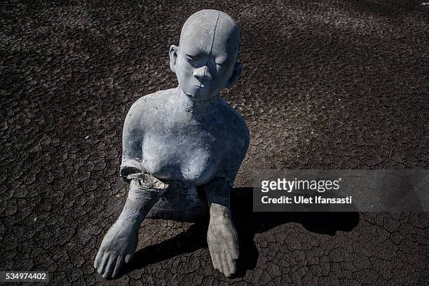Survivor statues are displayed at mudflow areas to signify the lives of victims on May 27, 2016 in Sidoarjo, East Java, Indonesia. On 29 May a...