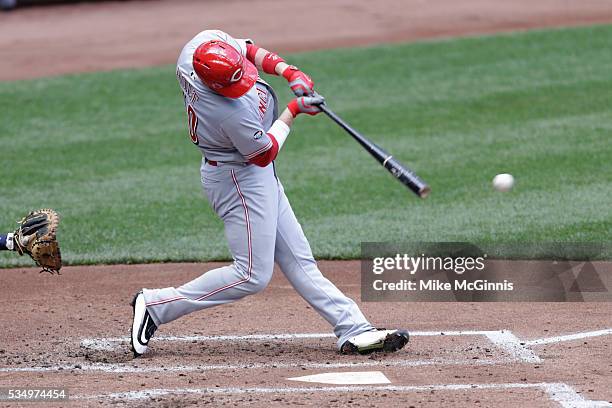 Tyler Holt of the Cincinnati Reds hits a single during the first inning against the Milwaukee Brewers at Miller Park on May 28, 2016 in Milwaukee,...