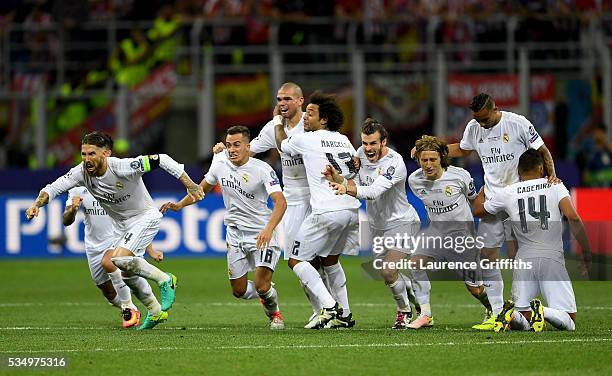 Real Madrid players celebrate celebrates after winning the Champions League Final after Cristiano Ronaldo scored the winning penalty in the penalty...