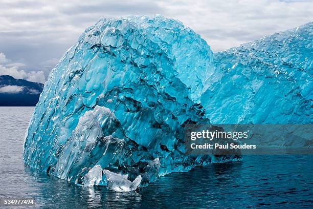 melting blue iceberg, alaska - holkham bay alaska stock pictures, royalty-free photos & images