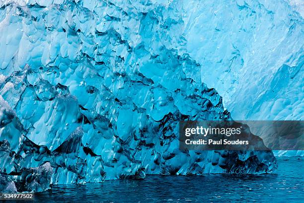 melting blue iceberg, alaska - holkham bay alaska stock pictures, royalty-free photos & images