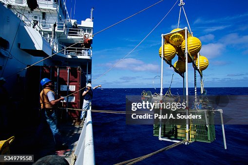 Men with Deep Ocean Sampling Device Men with Deep Ocean Sampling Device