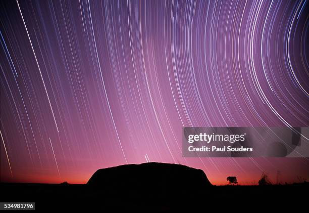 ayers rock and star trails, ulru - kata tjuta national park, australia - uluru stock pictures, royalty-free photos & images