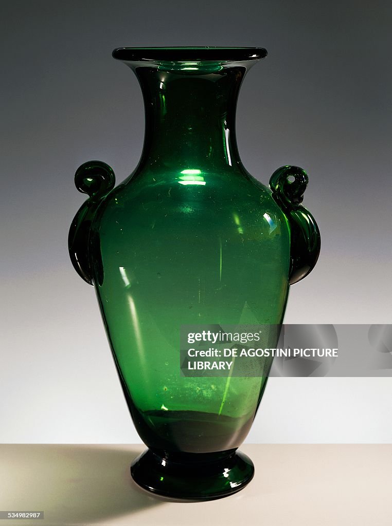 Handmade amphora in green mouth-blown glass...