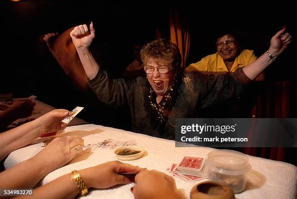 Winning card player shouts for joy. The gambler is a member of Jeanne's Bingo Buddies, a bingo club that travels from Houston to Oklahoma to play at...