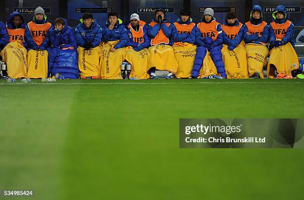 Ulsan Hyundai players watch on from the substitute's bench