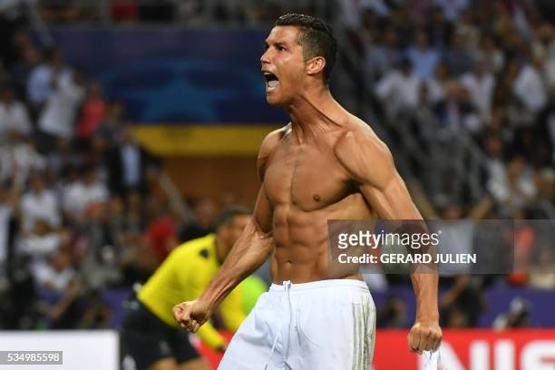 Real Madrid's Portuguese forward Cristiano Ronaldo celebrates after Real Madrid won the UEFA Champions League final football match over Atletico...