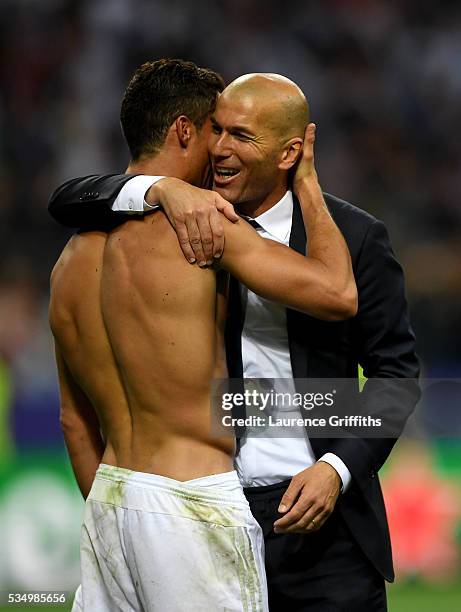 Cristiano Ronaldo of Real Madrid celebrates with head coach Zinedine Zidane after the UEFA Champions League Final match between Real Madrid and Club...