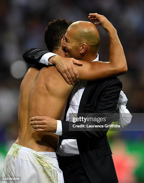 Cristiano Ronaldo of Real Madrid celebrates with head coach Zinedine Zidane after the UEFA Champions League Final match between Real Madrid and Club...