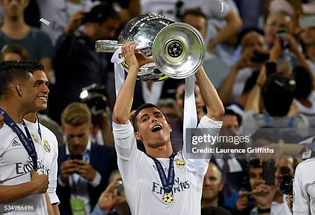 Cristiano Ronaldo of Real Madrid lifts the Champions League trophy after the UEFA Champions League Final match between Real Madrid and Club Atletico...