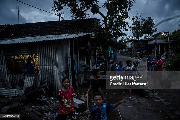 Children play in Merisen Village on May 27, 2016 in Sidoarjo, East Java, Indonesia. The Merisen village was damaged by the Sidoarjo mudflow and...